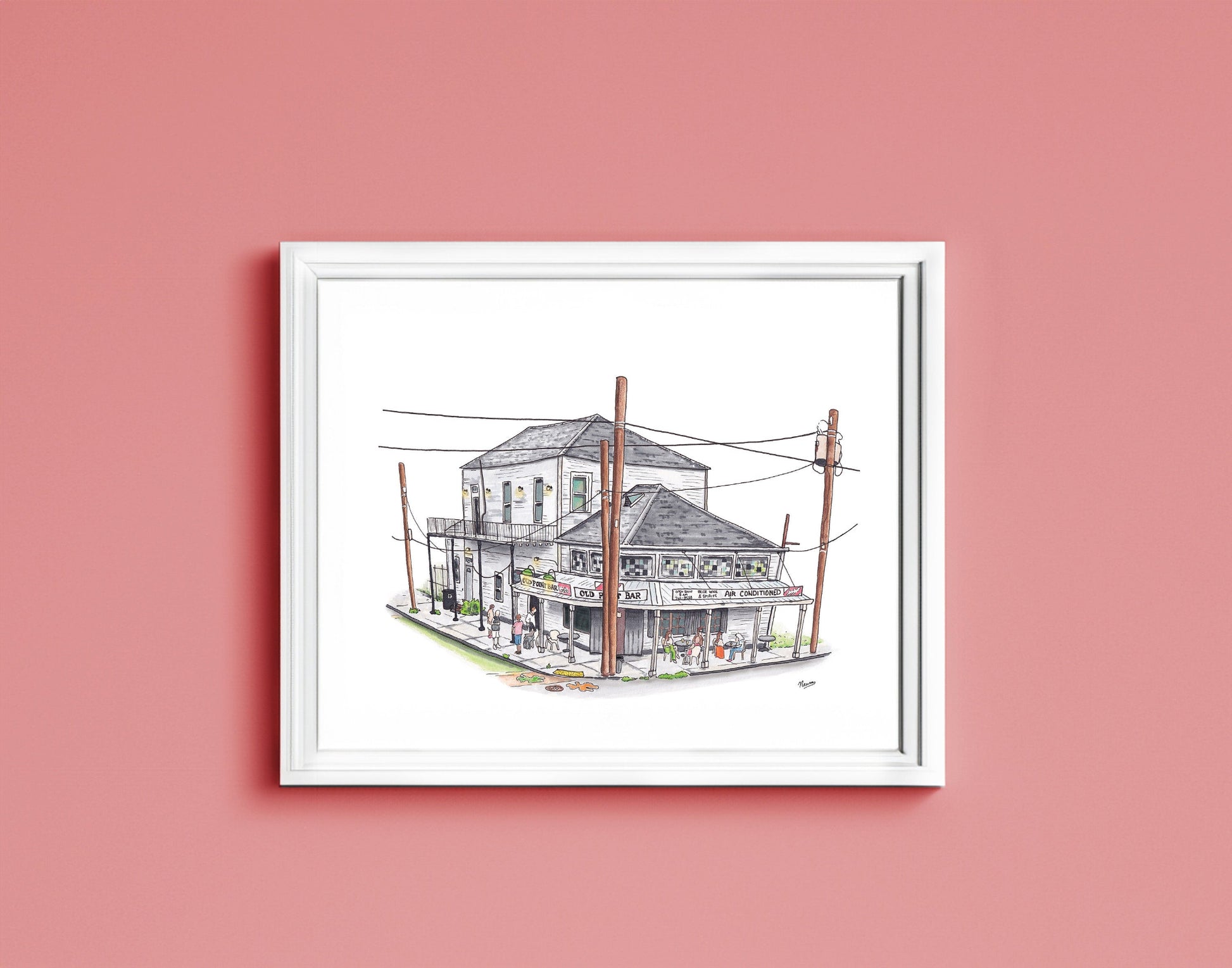 A detail of the Old Point Bar art print in a frame. The finished piece sits in a white frame that matches the background on which the building floats. The piece is hung on a pink wall.