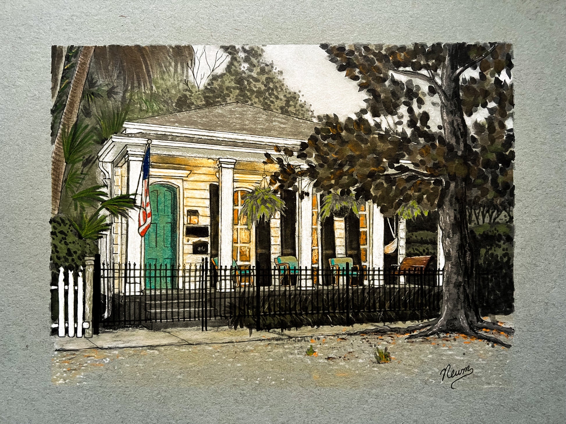 An example of a pastel custom home portrait commission art. A painting of a house with a green door and American flag, surrounded by trees and a fence.