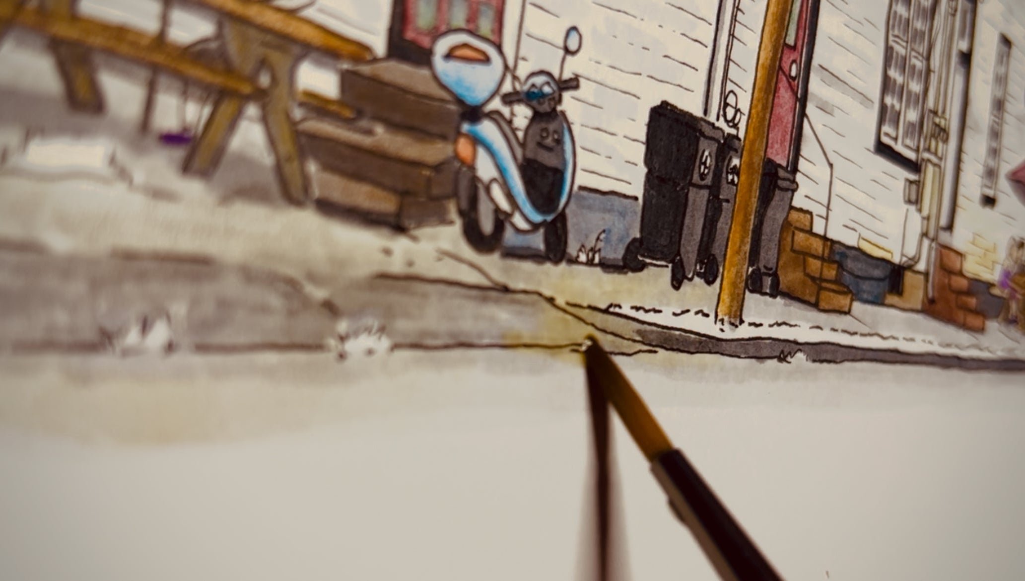 Newm adding watercolor to an illustration of The Crown & Anchor Pub in New Orleans.