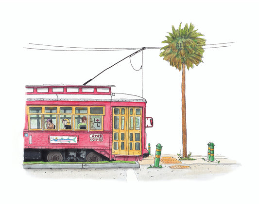 A product photo of the Canal Streetcar art print. A profile view of a New Orleans streetcar with passengers riding seen through the windows. The cables for the car are seen overhead, and a palm tree flanks the right. Tracks, posts, and tactile paving are seen on the ground.